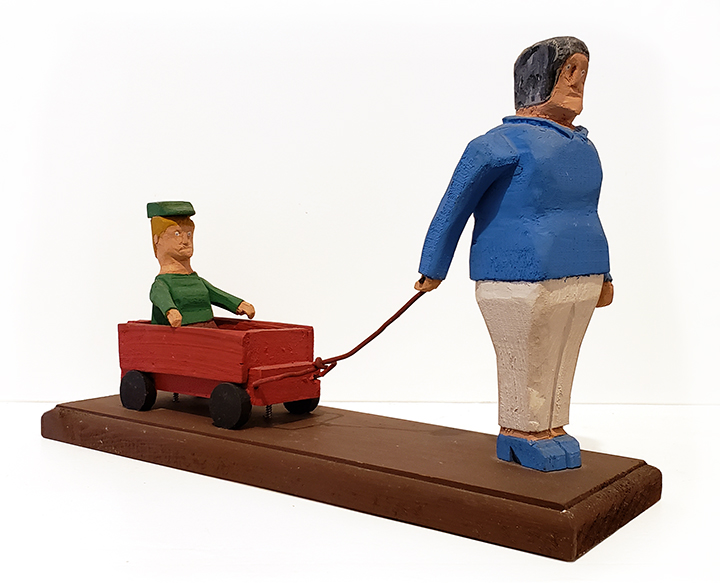 Mother Pulling Son In Wagon